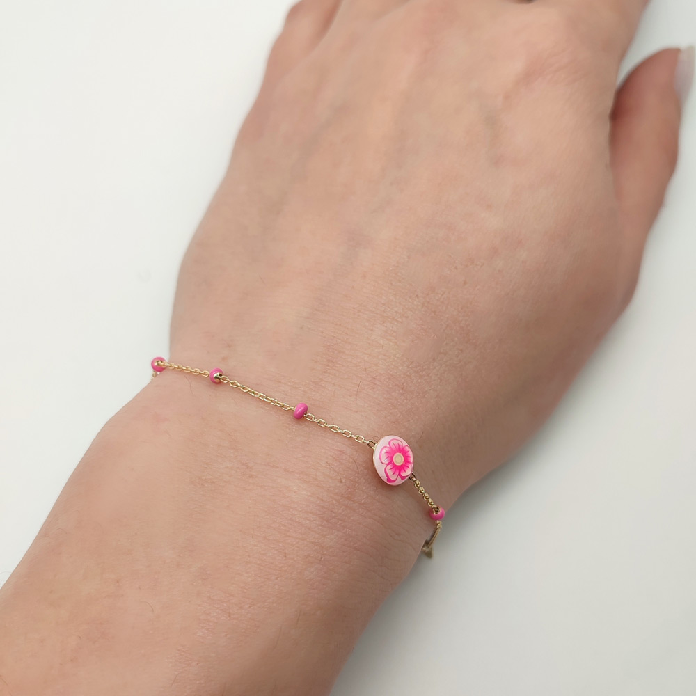 Βραχιόλι παιδικό για κορίτσι με 5 ροζ χάντρες και ένα ροζ λουλούδι από υγρό γυαλί χρυσό Κ14 – BRAX268